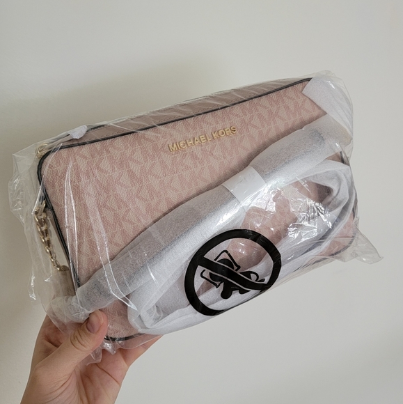 Michael Kors Handbags - Michael Kors Jet Set EW LG Crossbody Pink